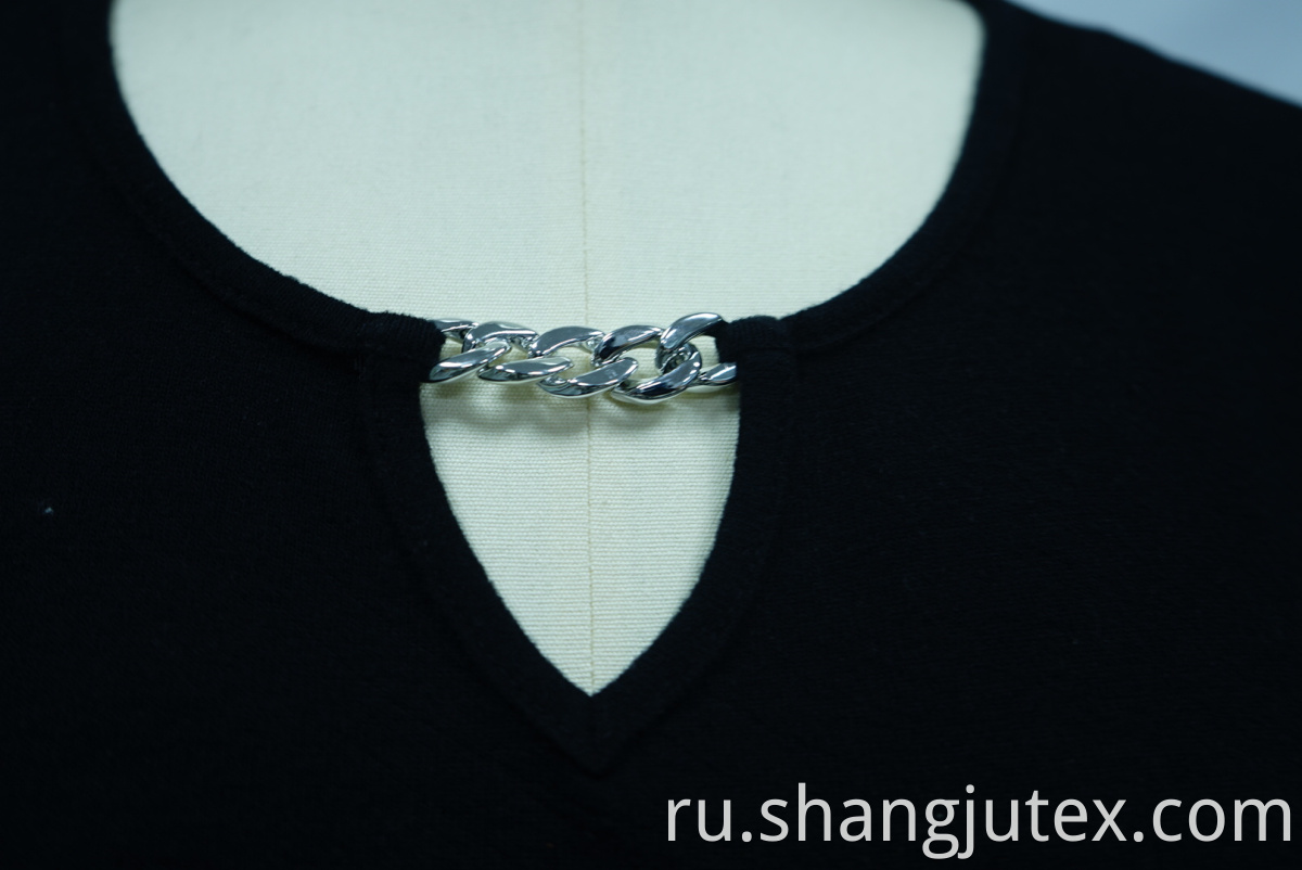 Chain included at V-neck of women's top